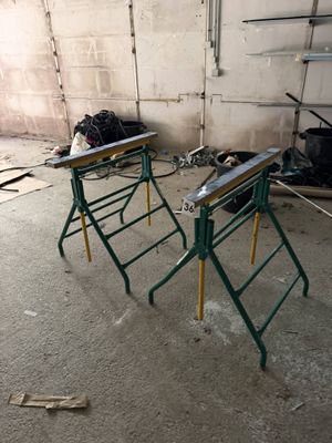 two tables that are sitting in the middle of a room