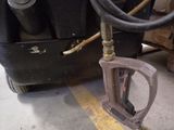 a hose attached to the back of a truck
