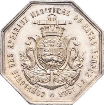 une image représentant une pièce d'argent sur laquelle figure un blason