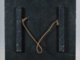a black door with a rope hanging from it ' s sides