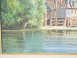 a picture of a painting of a house by the water