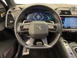the interior of a car with a steering wheel and dashboard controls