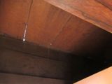 a close up of a ceiling with a wooden ceiling