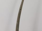 a wooden stick sticking out of a glass container