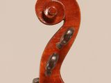 an old violin with a wooden back and a long neck