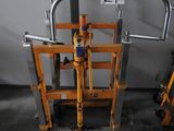 a metal cart with a handle on it in a room