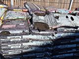 a pile of dirt sitting on top of a pile of cement