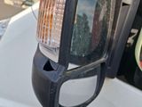 a close up of a rear view mirror of a truck