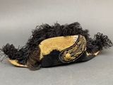 a black and gold hat with a gold trim on it