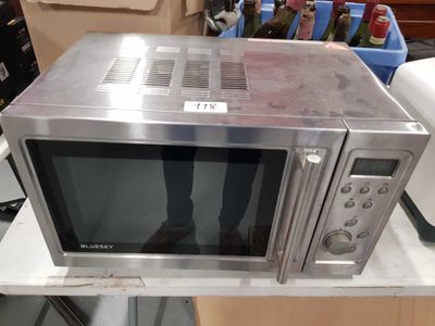 a microwave sitting on top of a table in a room
