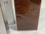 two boxes of perfume sitting next to each other on a white surface