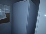 an image of a refrigerator in a dark room