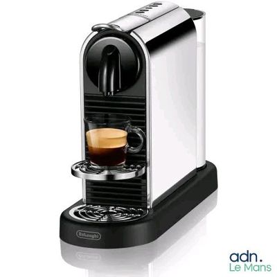 a close up of a coffee machine with a cup of coffee