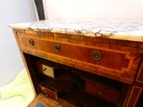 a marble top desk with a drawer underneath it