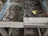 a table that has a bunch of metal items in it