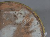 a close up view of a brown and white vase