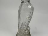 silver glass owl figurine sitting on top of a silver base