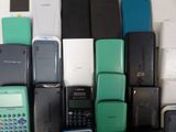 a lot of cell phones that are sitting on a table