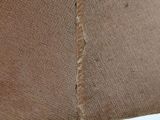 a close up of a lamp with a brown shade on it