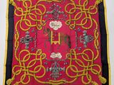 an image of a red and yellow scarf with a picture of a horse on it