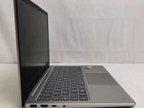 an open laptop computer sitting on top of a white table