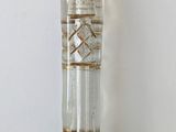 a glass bottle with a string wrapped around it