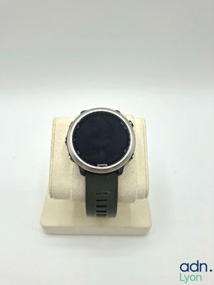 a close up of a smart watch sitting on a display stand