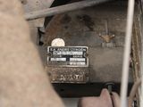 a close up of a car ' s engine with a label on it