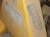 a yellow fork with a sign on it in a warehouse