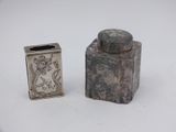 a small silver container and a small silver container