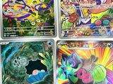 four different pokemon cards with different designs on them