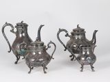 two silver teapots with handles and handles on a white background