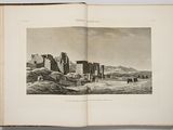 an open book with a drawing of ruins in the middle of it