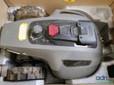 a box that has a lawn mower inside of it