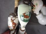 two vases that have been painted with animals on them