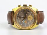 une montre marron et dorée avec un bracelet en cuir marron