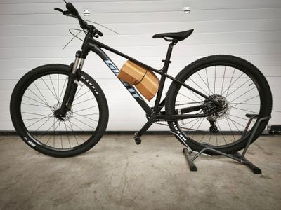 a bike that is parked in front of a garage door