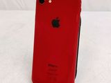 an image of a red iphone sitting on top of a white table