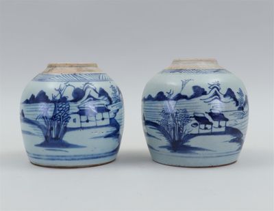 pair of chinese blue and white vases with landscape design