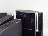 a black video game system sitting on top of a table
