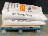 two bags of organic pilsen on a pallet