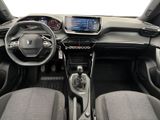 the interior of a car with a steering wheel, dashboard, and dashboard controls