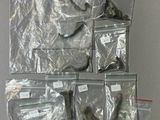 many bags of assorted items on the wall