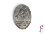 an old silver coin with a horse head on top of it