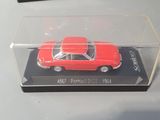 two toy cars in a clear box on a table