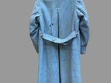 an image of a blue coat hanging on a hanger