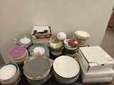 a pile of plates and bowls on a table
