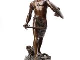 an image of a bronze statue of a man holding a shield and a dog