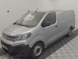 a picture of a silver van parked in a garage