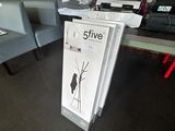 a sign in the middle of a room that says five five